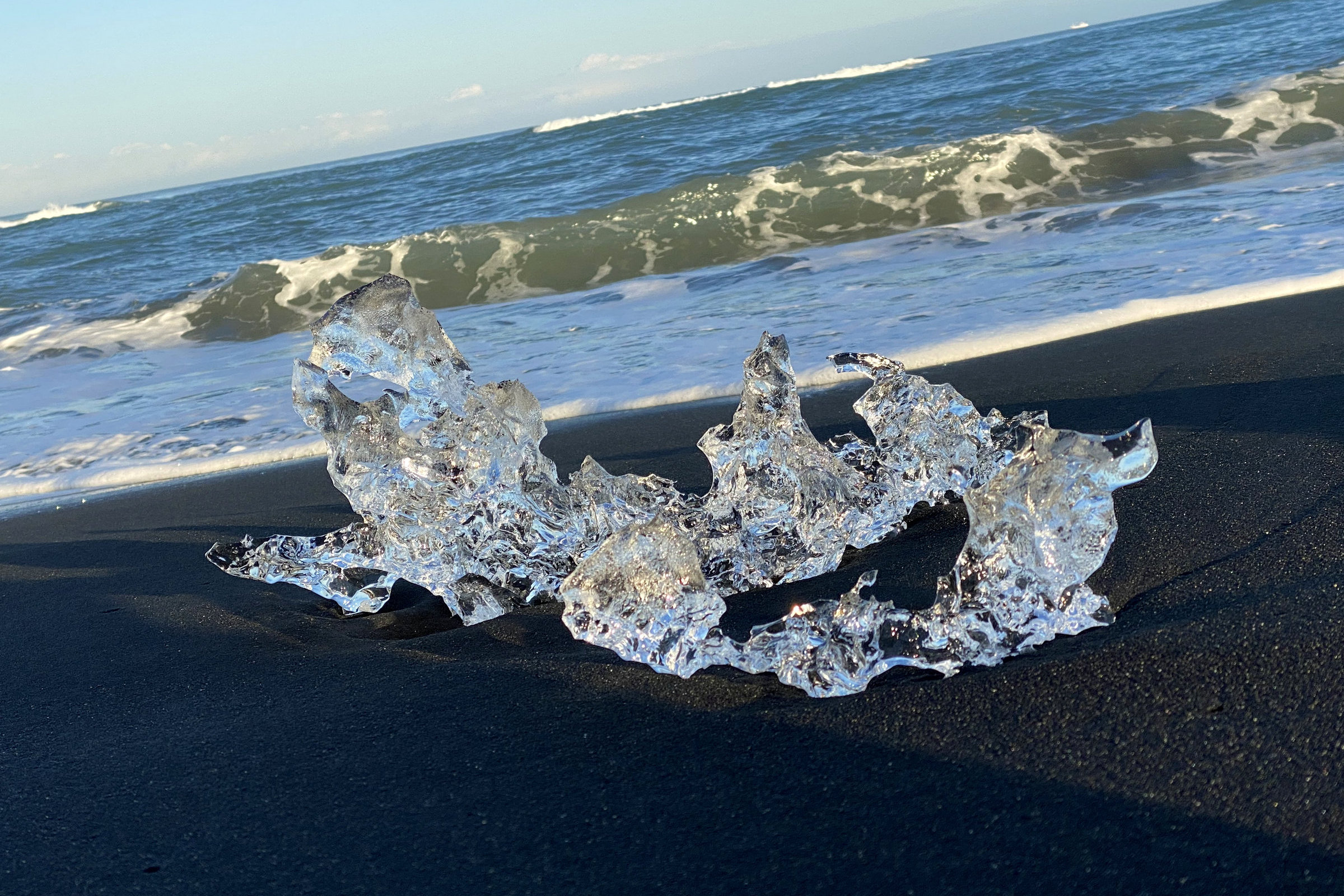 Ice fragment on black sand beach, Iceland
